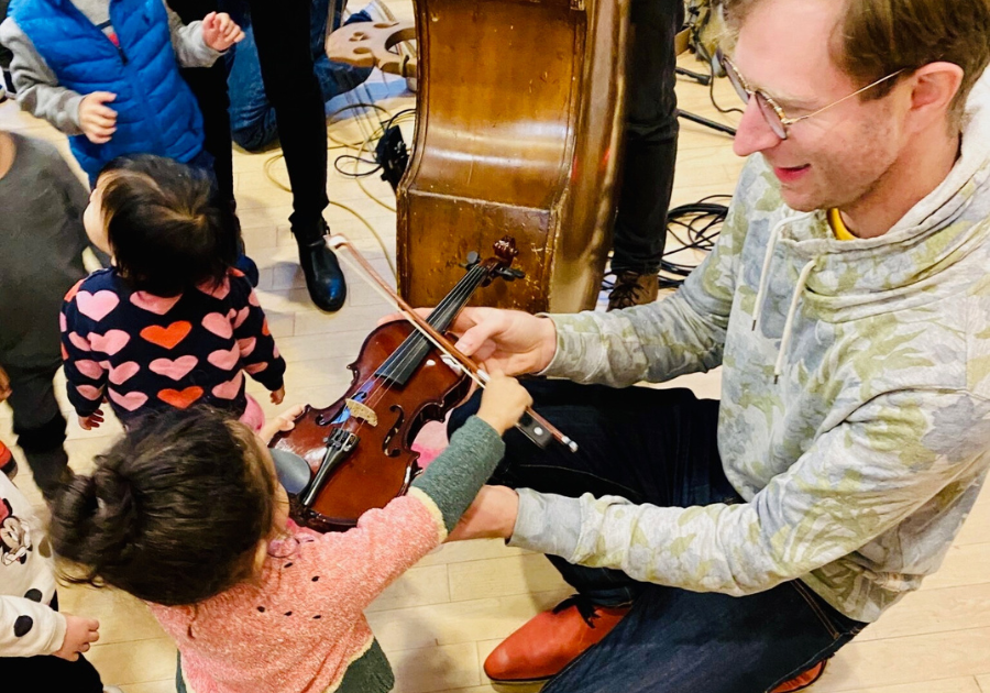 toddler playing with the violin toddler playing with the violin
