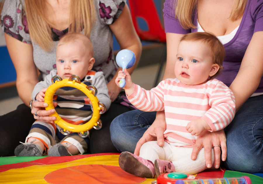 babies playing with toys, music