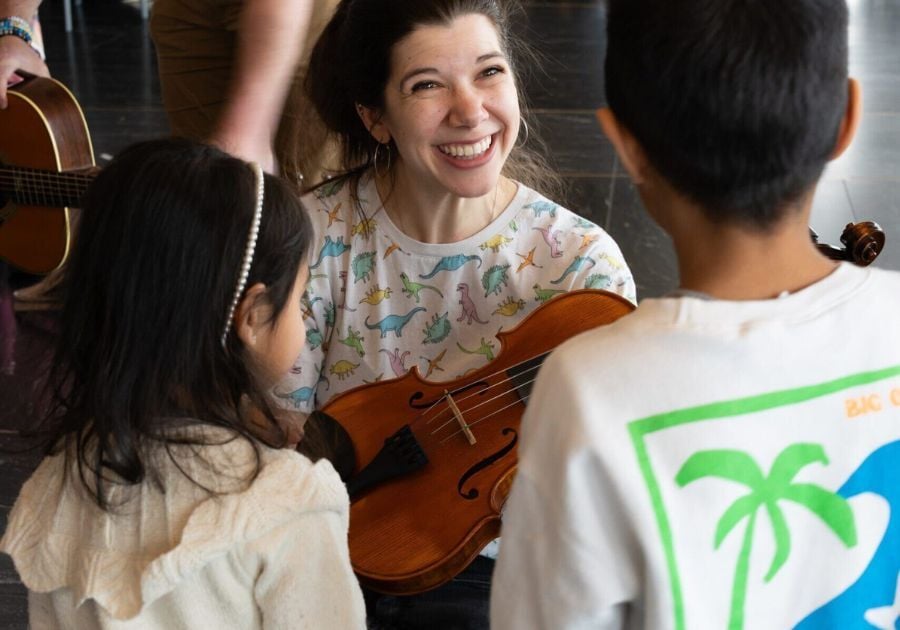 child listening to live music