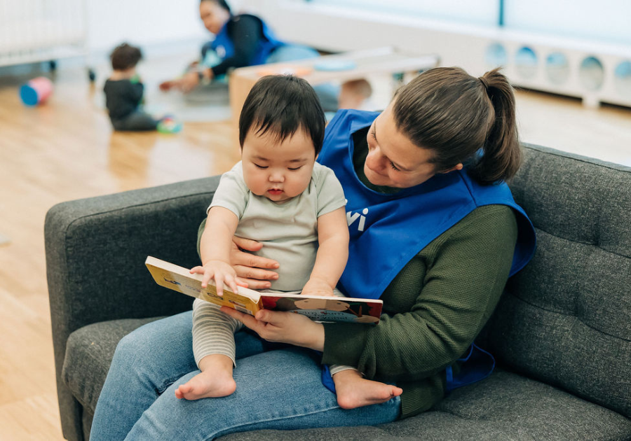 teacher reading to an infant 