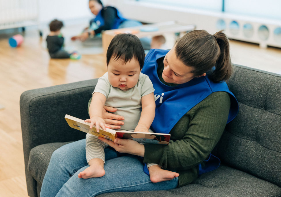 teacher reading to an infant teacher reading to an infant