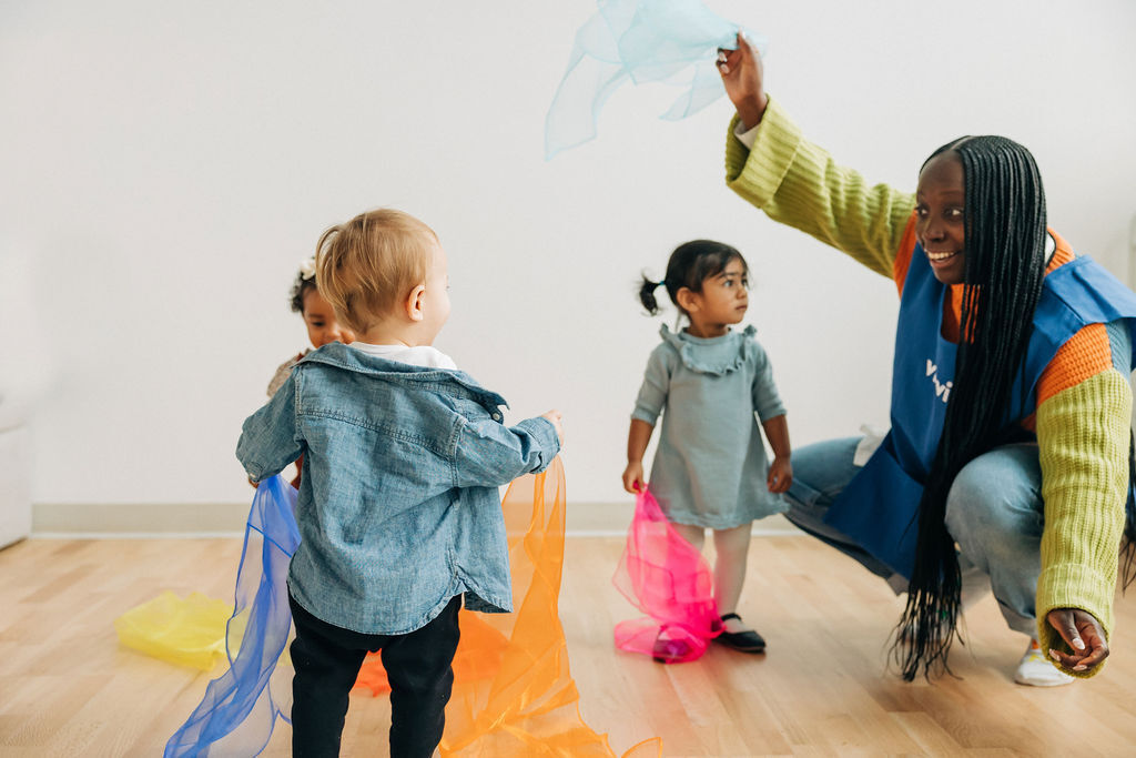 Teacher playing with toddlers